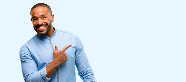 adult orthodontic patient with braces pointing to the side